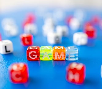 Dice spelling ‘game’