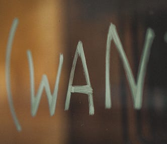 hand painted sign with the word WANT