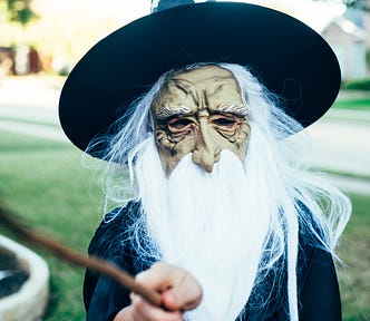 An wizened old wizard with his magic wand