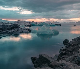 Iceberds and ice over a coastal landscape