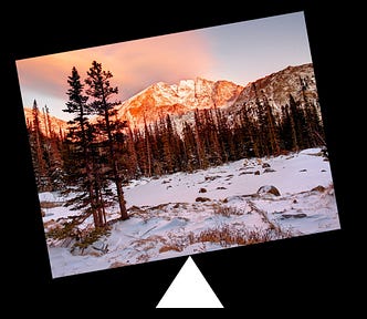 An image tipping to the left on a triangular fulcrum.