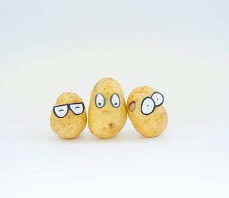 Three potatoes with embarrassed faces