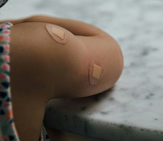 A picture of an arm with bandages on it.