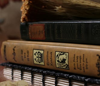 Old books piled up on top of each other