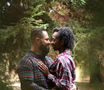 White man and Black woman romantically embracing