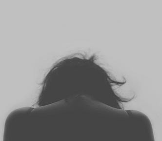 black and white image of a woman’s silhouette shoulder up