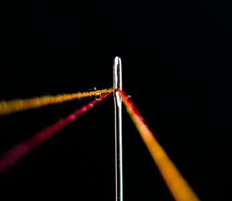 Threading a string through a needle
