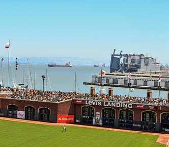 View from Club Level at Oracle Park looking across the Bay towards Oakland as Andrew McCutcheon man's right field. Best yard in baseball.