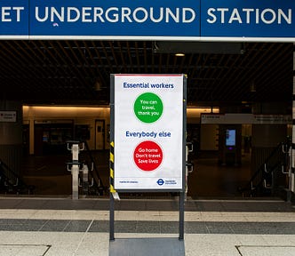 A sign in the London Tube alludes to the fact that those with COVID whould not travel.