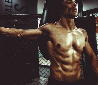 A man showing his body after doing 30-minute exercise every day for 285 days
