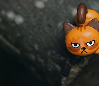 A toy cat with an angry face