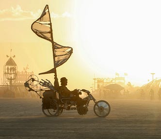 An art car passing through the frame at Burning Man, a week-long festival in the Nevada desert