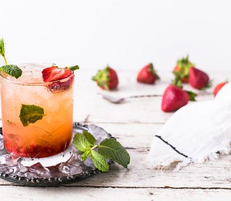 A fancy drink with fruit