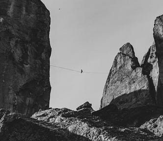 A high wire between two huge rocks