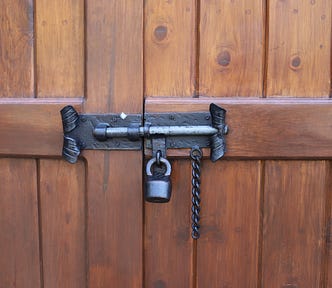 wooden door with black lock