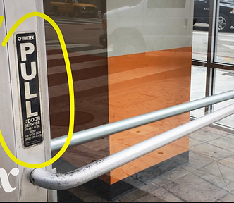 A door that looks like it could be pushed or pulled to open. The label on the door says pull, and the photographer highlighted that sign for emphasis.