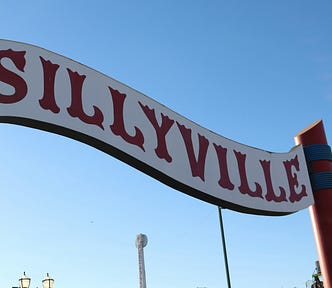 A curvy carnival sign reading, “Sillyville”