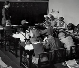 A group of school children busy at work.