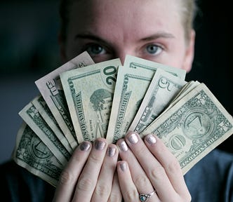 Woman holding cash