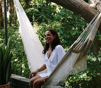 A woman relaxes in a hammock