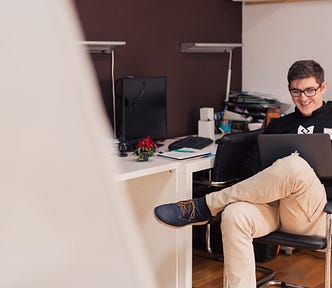 writer, writing, freelance writing, office worker, happy man, guy on laptop