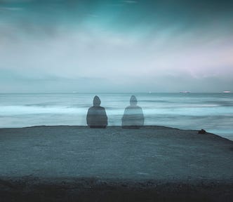 A man sitting on the sea shore. Nobles. Lost Wisdom Of Solitude.