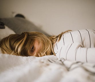 woman lying on a bed