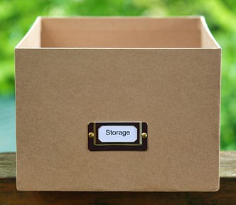 Empty cardboard box labeled storage