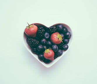 Heart-shaped bowl containing berries