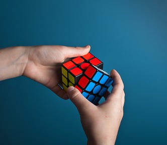 A person solving a Rubik’s cube.