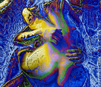 A female straddeled on a mans lap, his arms wrapped aroundher.