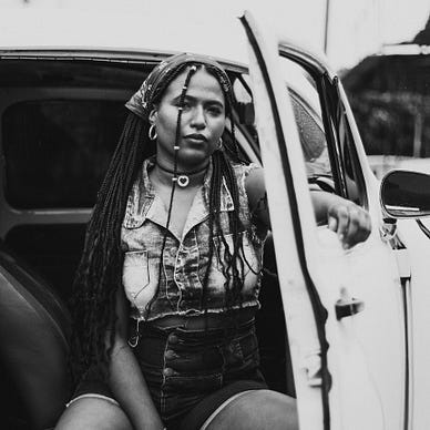 Black woman sitting in a car