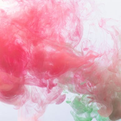 Puffs of pink and green smoke