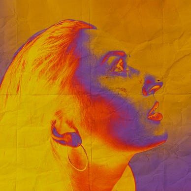 Artsy image of a woman with a colour palette of yellows, oranges, and some blues for shadow