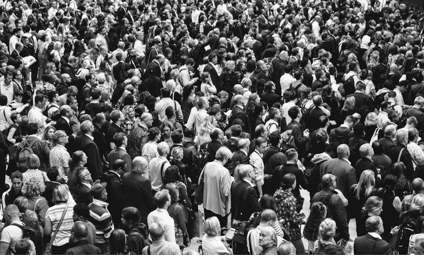Crowd conformity image showing how personal identity can become tied completely to a group.