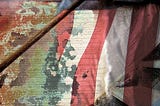 Tattered and faded American flag and Constitution — Image by cgrape from Pixabay