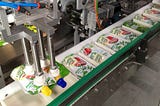 Robotics in Secondary Packaging Systems for the Food Industry