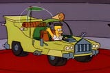 Homer Simpson in a car of his own design