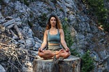 Woman in nature meditating