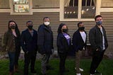 The entire NSBE Pro-PDX team of interns, Danielle Thompson and Eric Stratton, and four board members stand together in row with masks on.