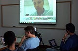 Haas MBAs sit in a global video conference training hosted by Bridges Ventures