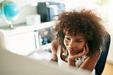 A woman working intently at her desk