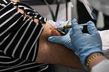 A participant in a Covid-19 vaccine trial receives a dose of the vaccination in Hollywood, Florida…