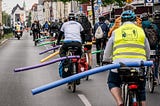 Cyclists with pool noodles signalling cars must give 1.5m of passing space