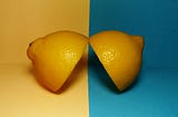 Two halves of a lemon on various backgrounds signal a duality