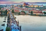 The old Charles bridge and in the background the Prague Castle and Cathedral.
