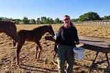 Theresa in her happy place - with horsies!