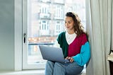 Relaxed woman working from her home.