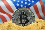 Bitcoin symbol in front of American flag