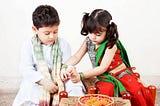 Young boy and girl celebrate Raksha Bandhan